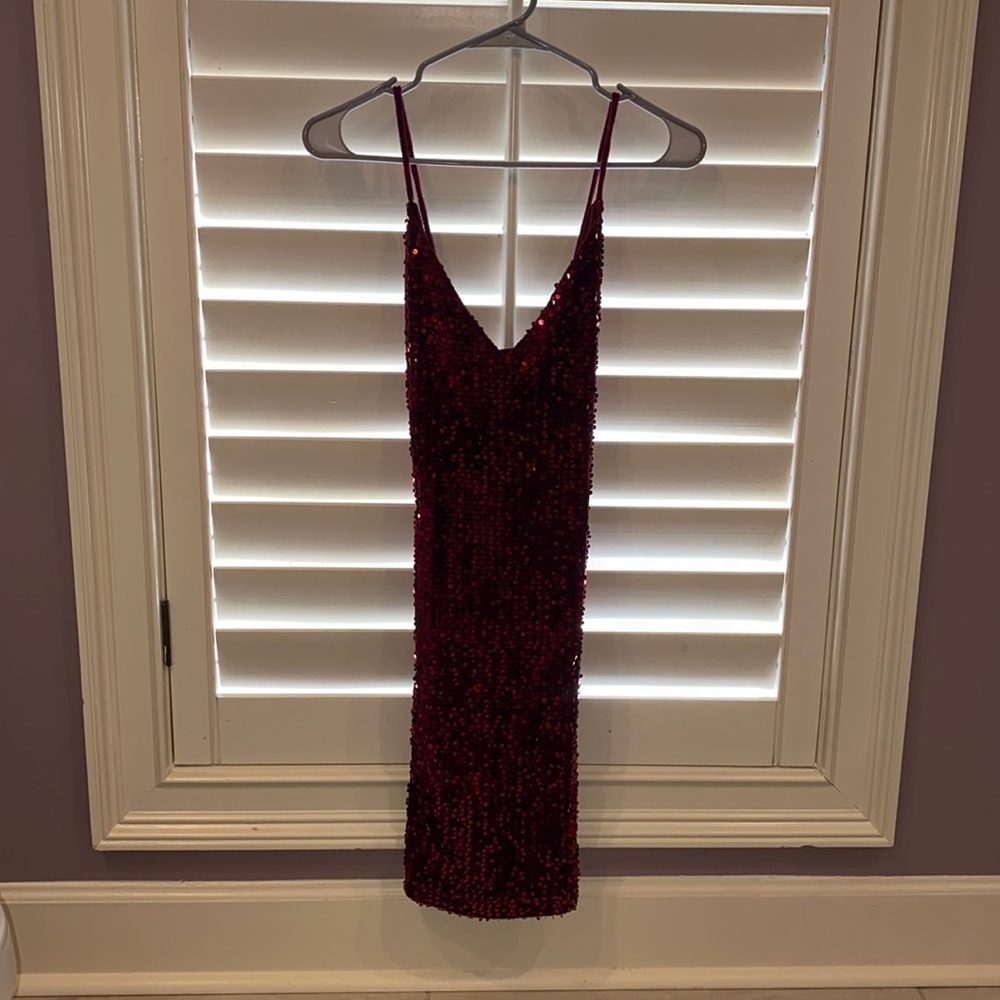 This is a burgundy sequin dress from IN San Francisco and is a size 7.